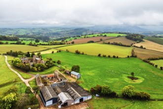 Autumn Colours over ruins of Pembridge Castle or Newland Castle from a drone, Herefordshire,