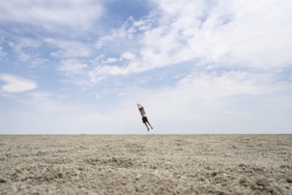Symbolic picture, abstract, man at the Etosha pan, salt pan, Etosha National Park, Namibia