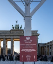 Large Hanukkah chandelier at the Brandenburg Gate in daylight, sign of lively Jewish life, symbolic