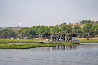 Tourist safari boat in Chobe River, Chobe Waterfront, Ihaha, Chobe National Park, Botswana