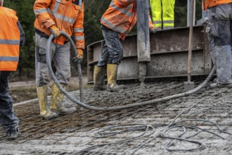 Concreting, concreting the foundation of a wind turbine, concrete pump hose, compressor, more than