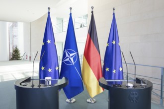 Flags of the Federal Republic of Germany, the EU and NATO after a press conference by Mark Rutte