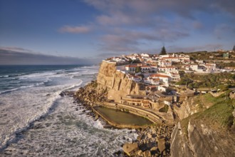 Scenic view of the seaside Azenhas do Mar fishing village on cliff on Atlantic ocean coast,