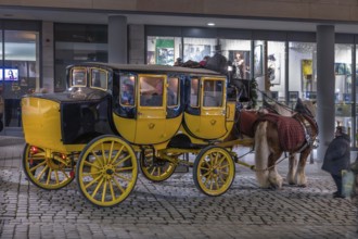 Historic stagecoach rides with horseback during the Nuremberg Christmas Market, Nuremberg, Middle