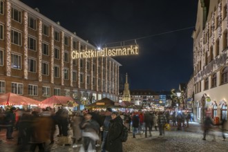 Entrance to the illuminated Nuremberg Christmas Market, with City Hall and the Beautiful Fountain,