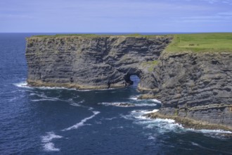 Cliff coast with rock arch, Kilkee, County Clare, Ireland