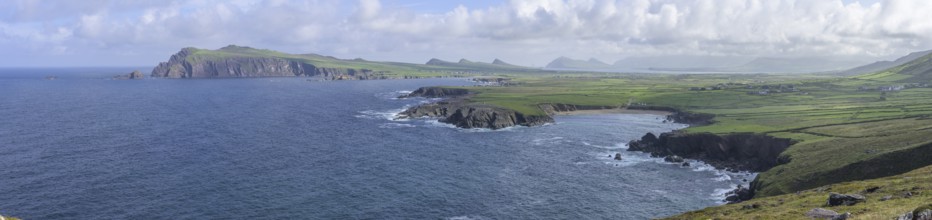 Coast with cliffs in the background An Triúr Deirféar (The Three Sisters), Clogher, Kerry, Ireland