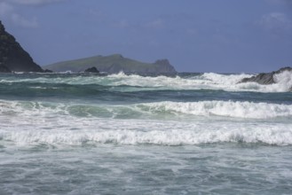 Waves crashing against cliffs in the background Inishtooskert Island (sleeping Giant), Clogher