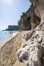 Sandy beach beach and steep cliffs at Cala Luna, Golfo di Orosei, Baunei, Sardinia, Italy