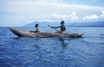 Two boys in a dugout on Lake Malawi, Malawi, Africa, July 2000, vintage, retro, old, historic