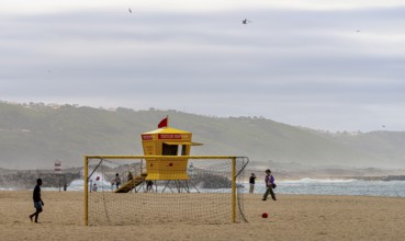 Yellow lifeguard surveillance container on Nazare beach, Portugal