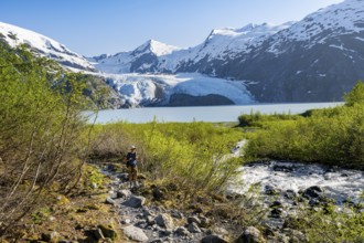 Hikers on the Portage Pass Trail, snowy mountains, Portage Glacier and Portage Lake, near Whittier,
