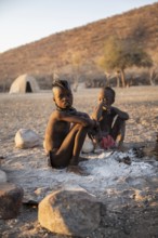 Himba children at the fire early in the morning, traditional Himba village, Kaokoveld, Kunene,