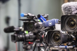 Cameras from various television stations are prepared for a press conference. Stuttgart,