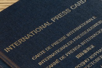 Close-up of an international press pass