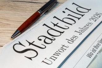 Possible bad word of the year? Symbolic newspaper with the headline CITYSCAPE — UNWORD OF THE YEAR