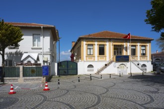 Cobblestone street with historic buildings and a Turkish flag, museum, Naval Museum, Canakkale,