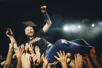 Billy Lunn, singer and guitarist from The Subways, crowd-surfing the fans live on For Eternity Tour