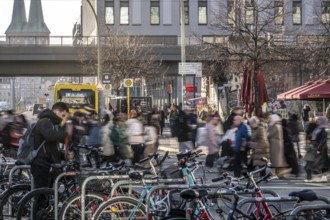 Passers-by on a Grunerstraße pedestrian crossing near Alexander Platz, bicycle parking lot in