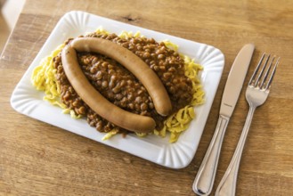 Swabian favorite dish. Lentils, spaetzle, side sausage. Stuttgart, Baden-Württemberg, Germany