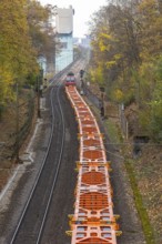 Freight train traveling on open route. Münster CHP plant. Stuttgart, Baden-Württemberg, Germany
