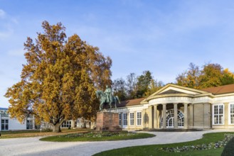 Spa garden Bad Cannstatt in autumn. Large Kursaal with equestrian sculpture of Wilhelm I Stuttgart,