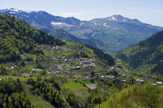 A picturesque village surrounded by alpine hills offers impressive views, village in the Lesser