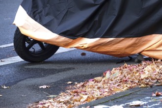Motor scooter with cover, late autumn, Germany