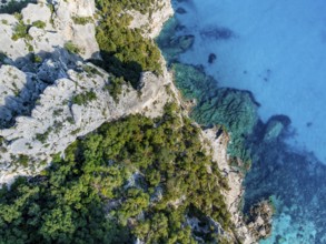 Picturesque rocky coast, blue sea at Cala Goloritzé, top-down, aerial view, Golfo di Orosei,