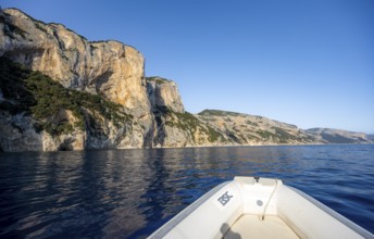 Motorboat trip along the picturesque rocky coast, cliffs and blue sea, Golfo di Orosei, Baunei,