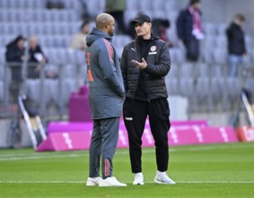 Coach coach Vincent Kompany FC Bayern Munich FCB talking to coach coach Alexander Blessin FC St.
