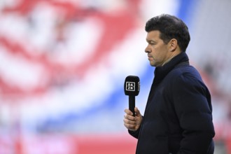 TV expert Michael Ballack interviewed microphone in front of logo FC Bayern Munich, Allianz Arena,