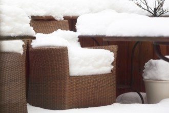 Snow-covered garden chairs, winter, Germany