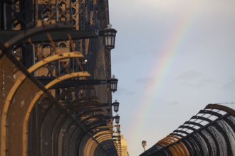 Details of the famous Sydney Harbour Bridge in the evening light with a rainbow