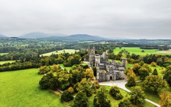 Autumn colours over Penrhyn Castle and Garden from a drone, Llandygai, Bangor, Gwynedd, North