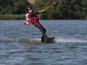 Boy or girl with wakeboard, sporty on the water, active water sports, wake park
