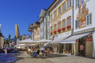 Historic market street with street cafe and typical gabled houses, Bad Tölz. Isartal, Upper