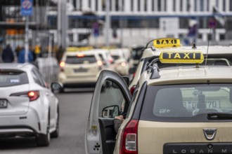 Taxis in front of the main train station in Berlin, waiting in line for passengers, Germany
