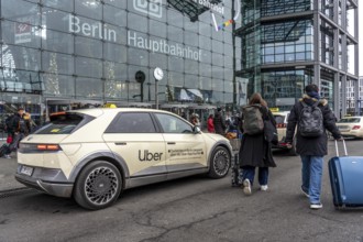 Uber taxi in front of the main train station in Berlin, waiting in line for passengers, Germany