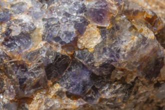 This scene shows a large rock fragment that contains quartz and fluorite crystals. Reflections and