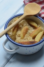 Fried puff noodles with sauerkraut in pots
