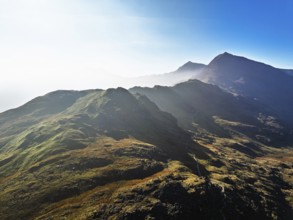 Autumn colours of Pen-y-Pass over Miner's Track, Start Point and road A4086 from a drone,