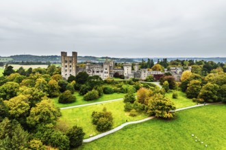 Autumn colours over Penrhyn Castle and Garden from a drone, Llandygai, Bangor, Gwynedd, North
