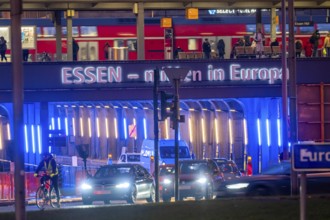 The main train station in Essen, blue-lit underpass, bus station, am Europaplatz, public transport