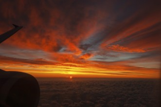 View from airplane window at sunrise