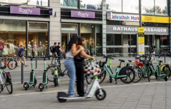 Electric scooters and rental bikes on public roads, Berlin, Germany