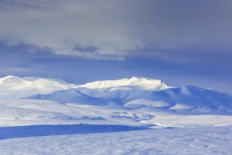 Snow covered mountains in Arctic landscape at Mohnbukta, bay at the western shore of Storfjorden in