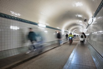 Interior view, pedestrians and cyclists crossing tunnel, mopping effect, movement, tube, historic