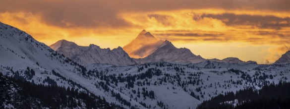 Grossglockner peaks at sunset in winter, spectacular cloudy skies, Hochbrixen, Brixen im Thale,