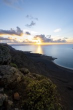 View of steep cliffs on sea and coast, Mirador del Porrito viewpoint at sunset, Lanzarote, Canary